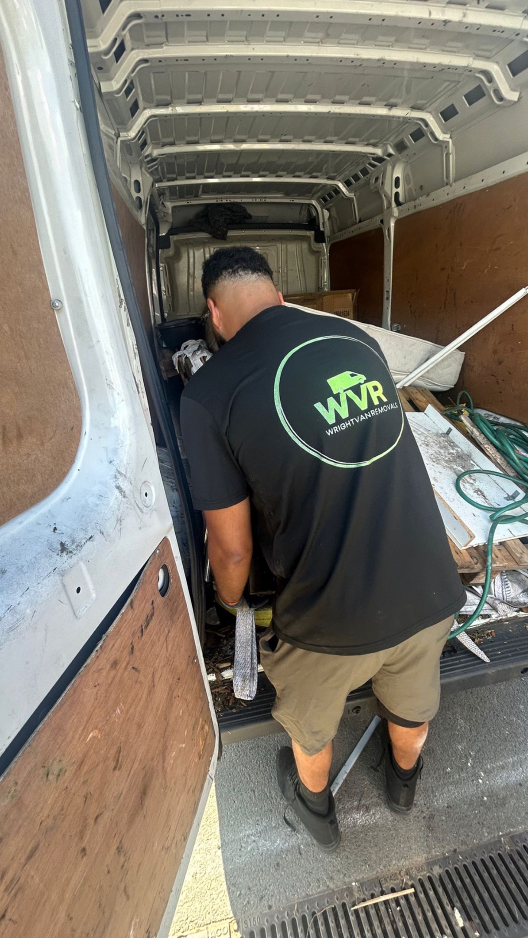 WVR loading pallets and garden waste from a business site clearance